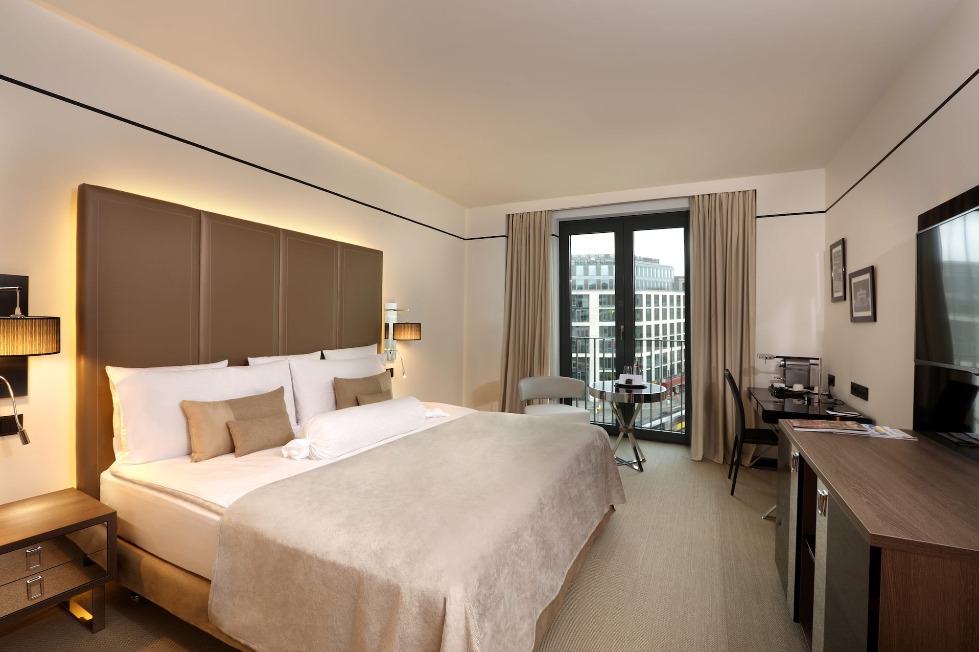 a room with a bed and desk