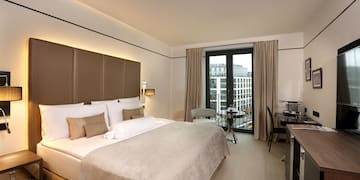 a room with a bed and desk