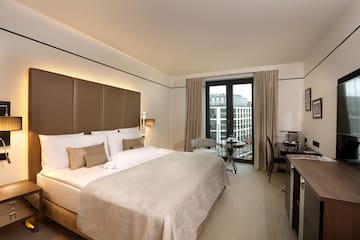 a room with a bed and desk
