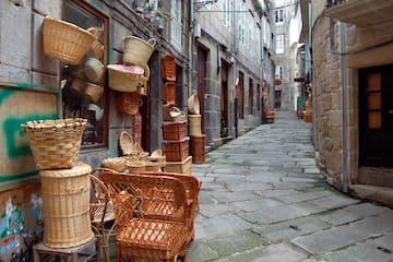 a street with wicker baskets and chairs