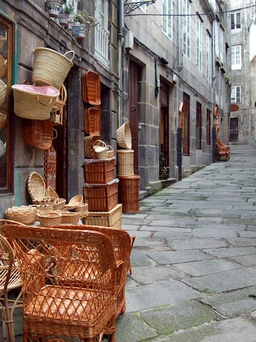 a street with wicker baskets and chairs
