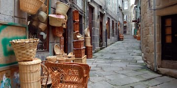 a street with wicker baskets and chairs