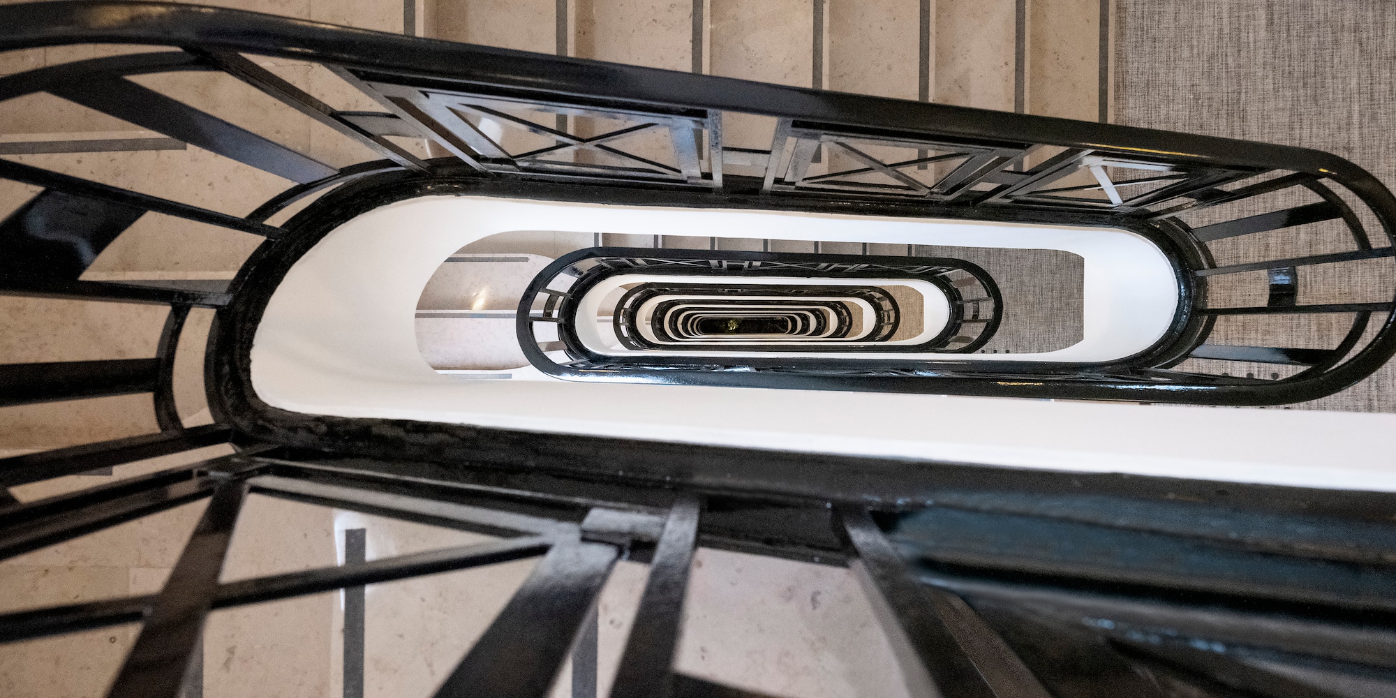 a staircase with a black railing