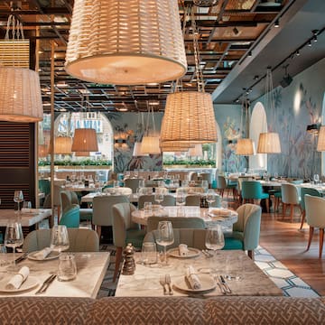 a restaurant with tables and chairs