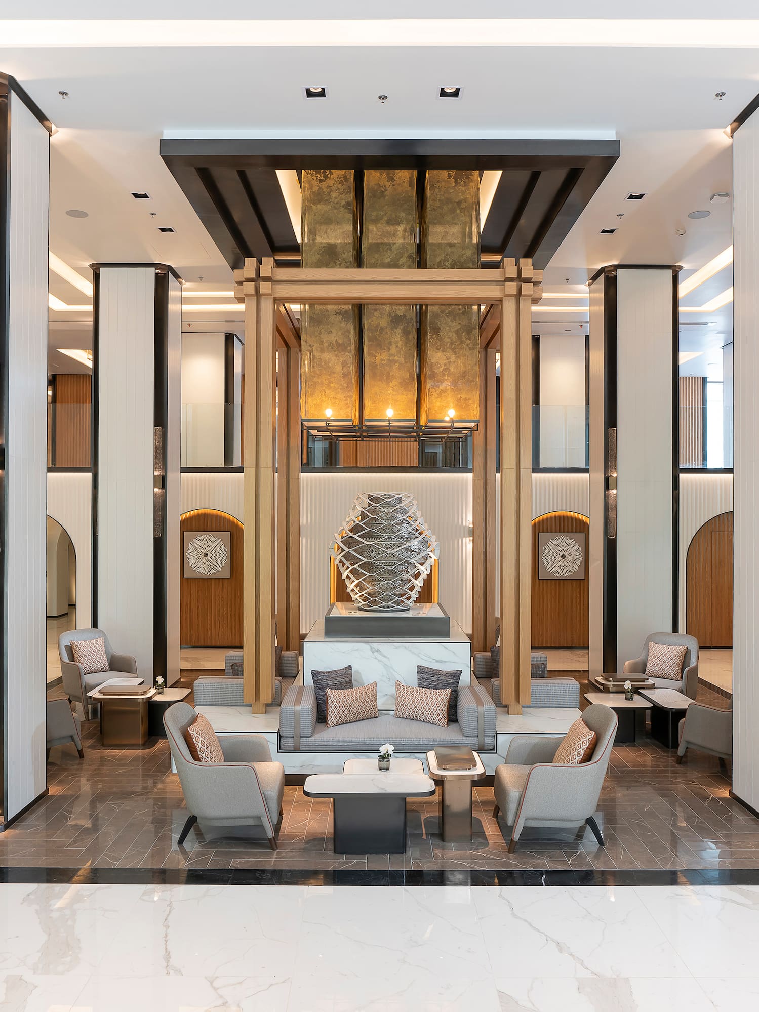 a lobby with a large statue of a sculpture