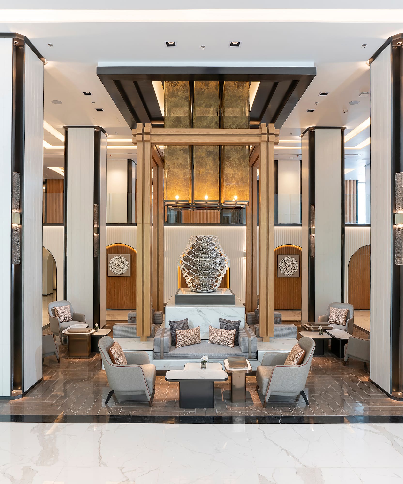 a lobby with a large statue of a sculpture