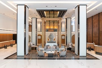 a lobby with a large statue of a sculpture