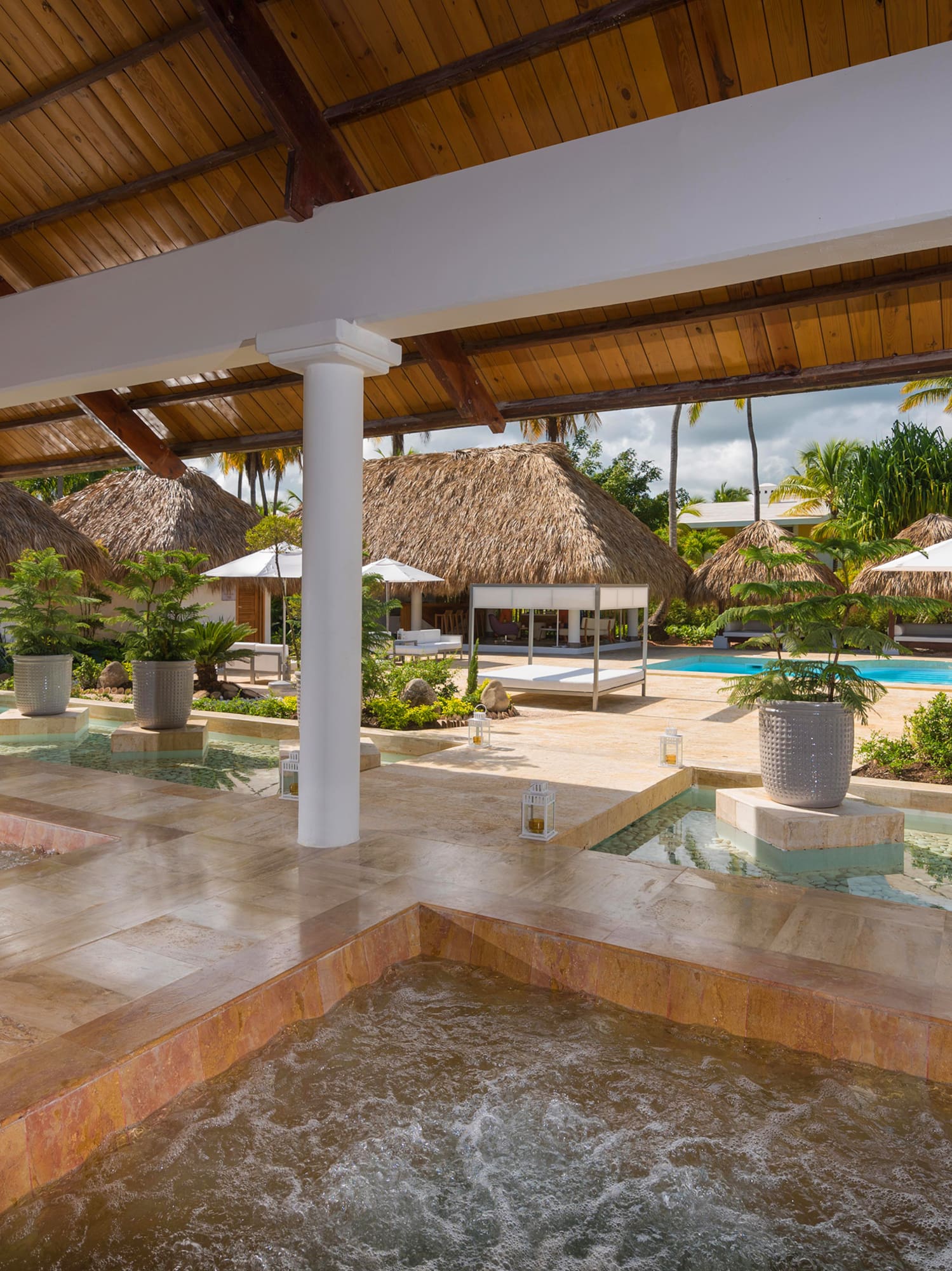 a pool with hot tubs and a pool in the middle