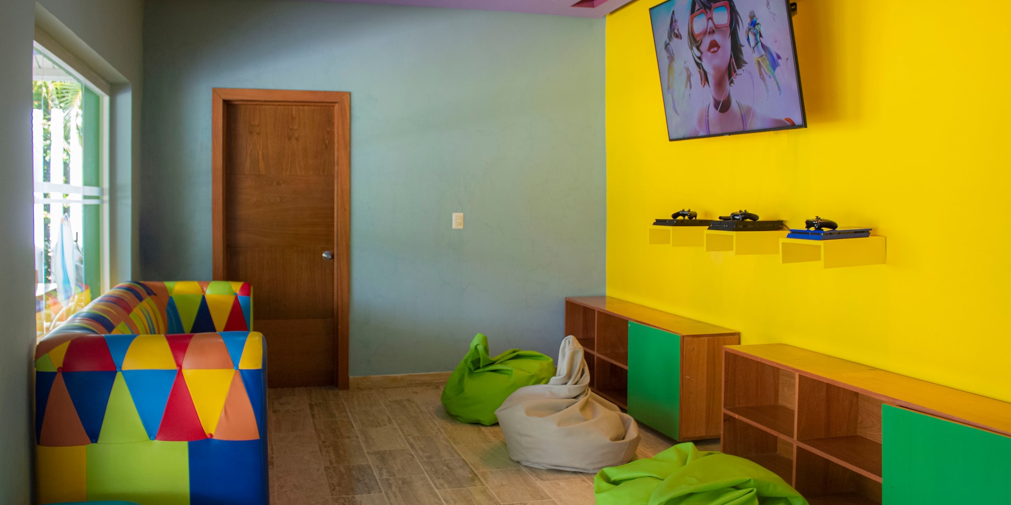 a room with colorful furniture and a couch