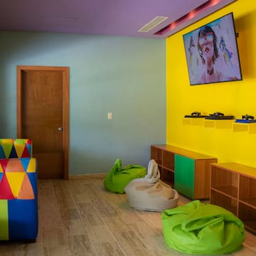 a room with colorful furniture and a couch