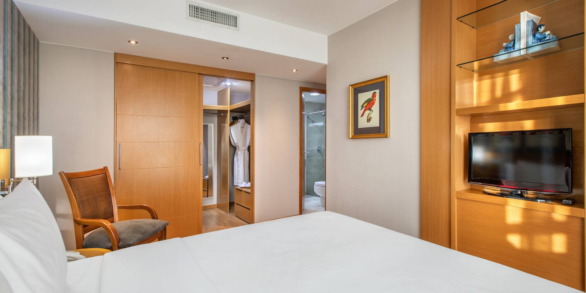 a room with a bed and a tv