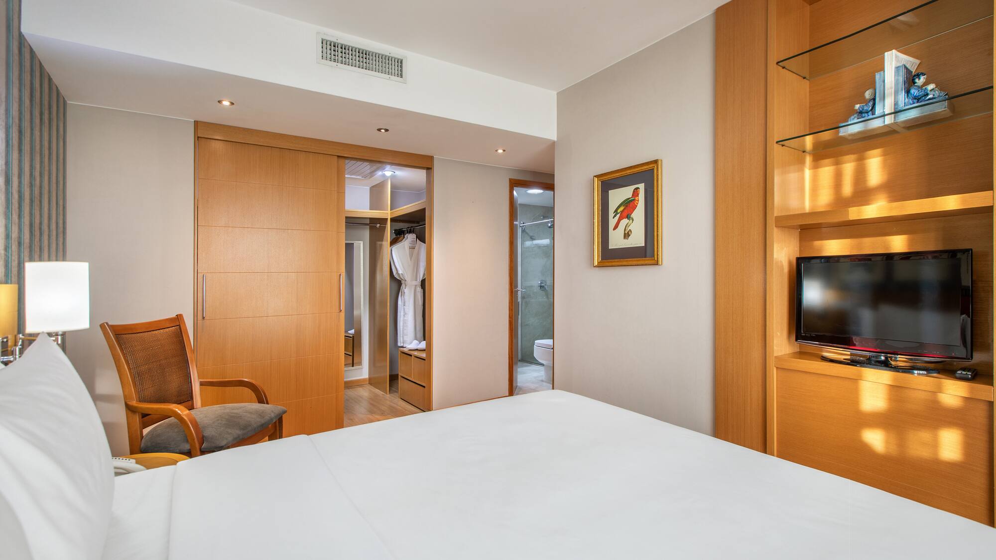 a room with a bed and a tv