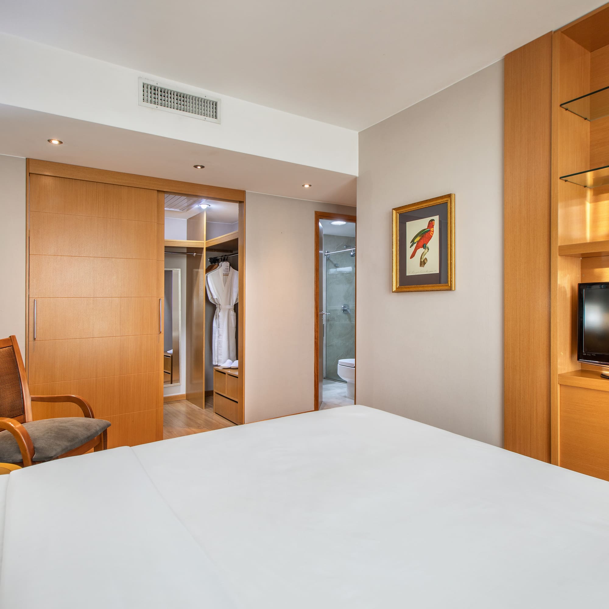 a room with a bed and a tv