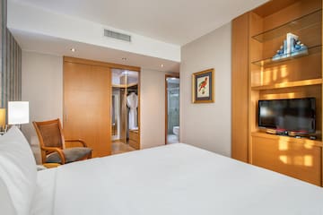 a room with a bed and a tv