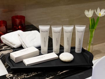 a tray with white containers and white objects on it