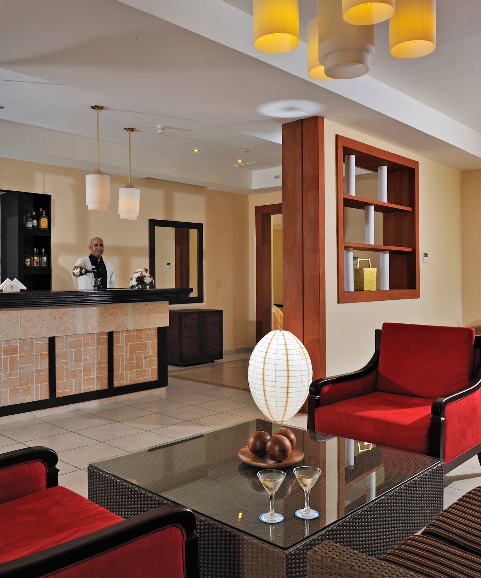 a hotel lobby with a man standing behind the counter