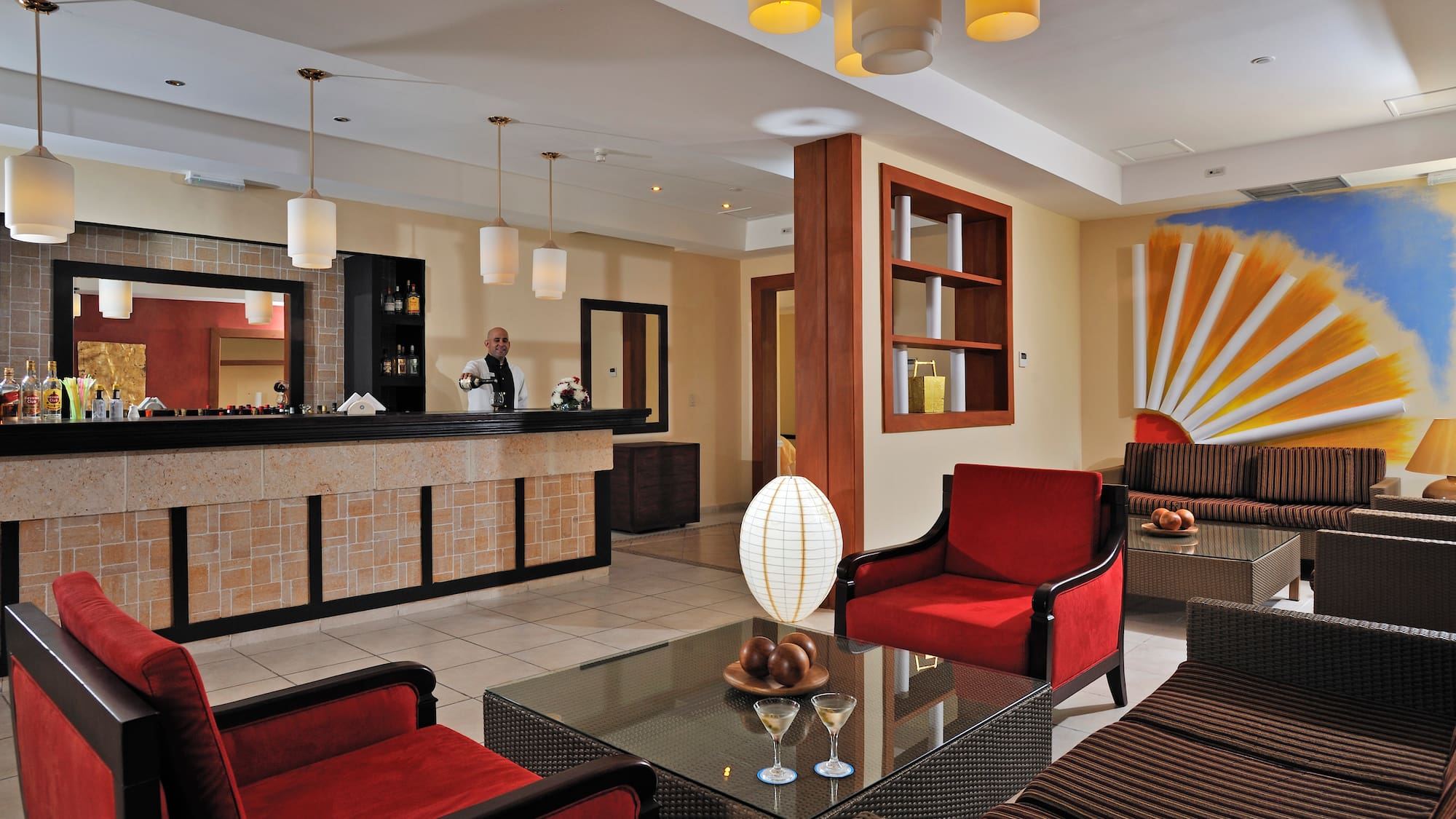 a hotel lobby with a man standing behind the counter