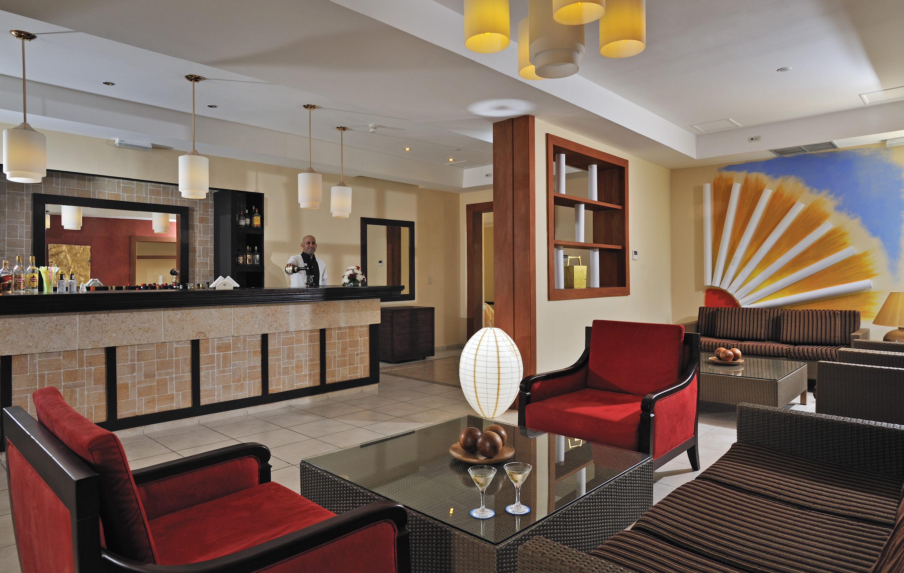 a hotel lobby with a man standing behind the counter