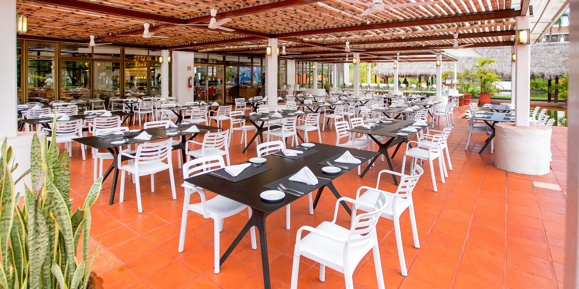 a restaurant with tables and chairs