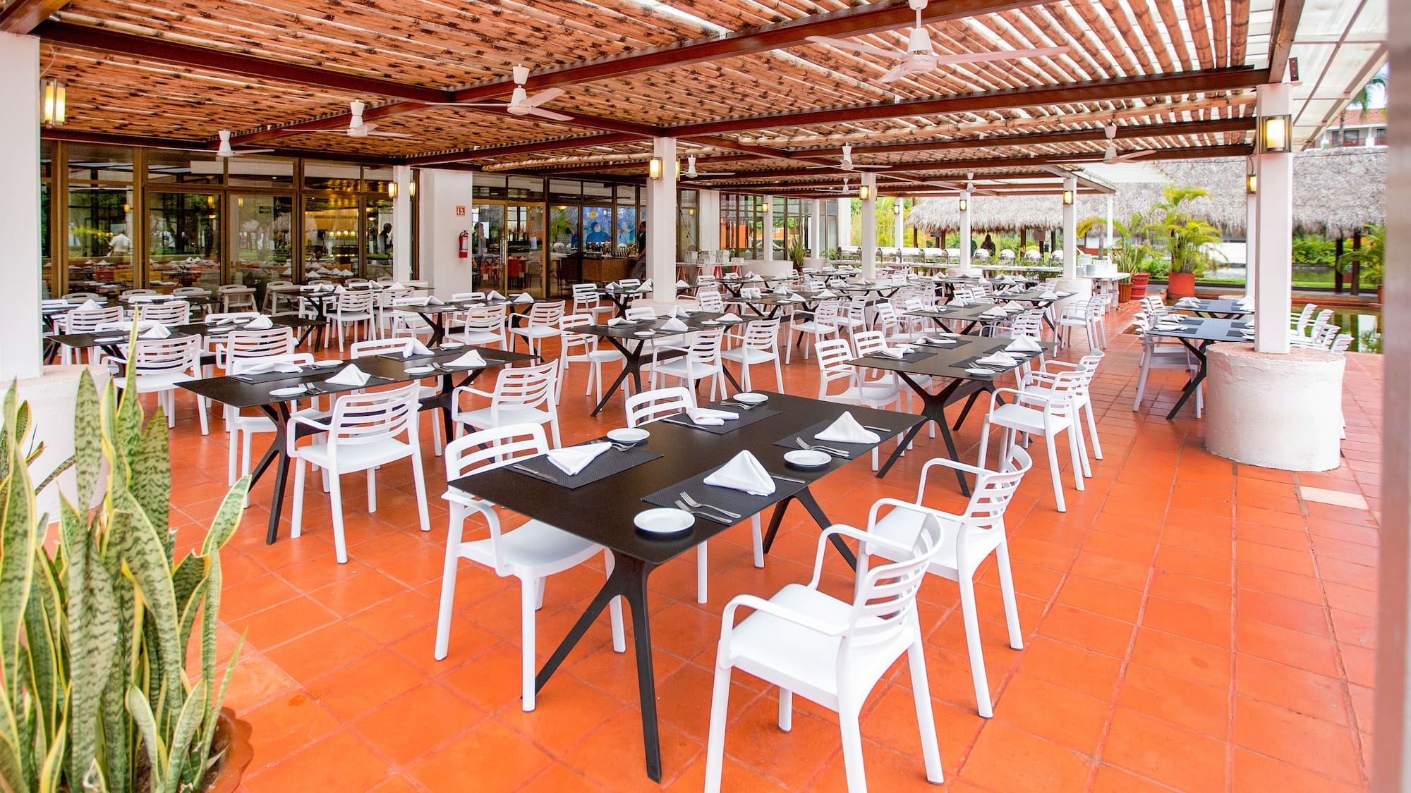 a restaurant with tables and chairs