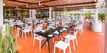 a restaurant with tables and chairs