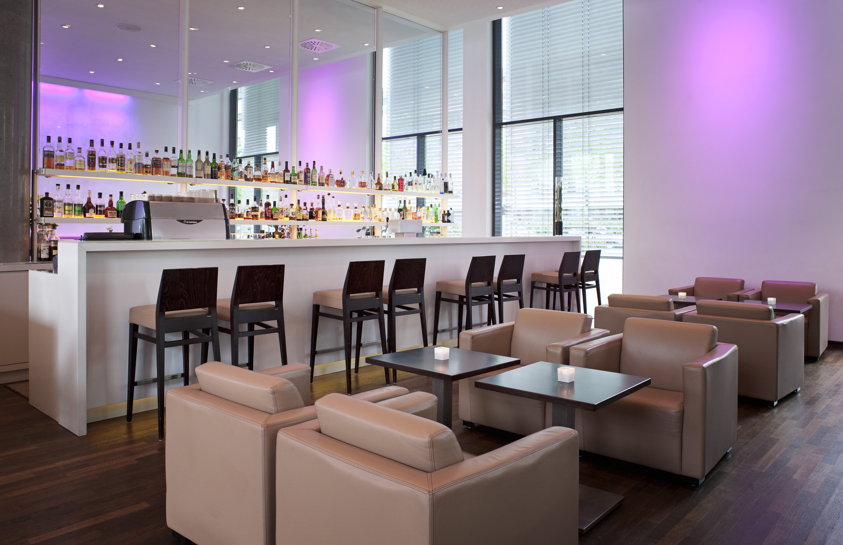 a bar with chairs and tables