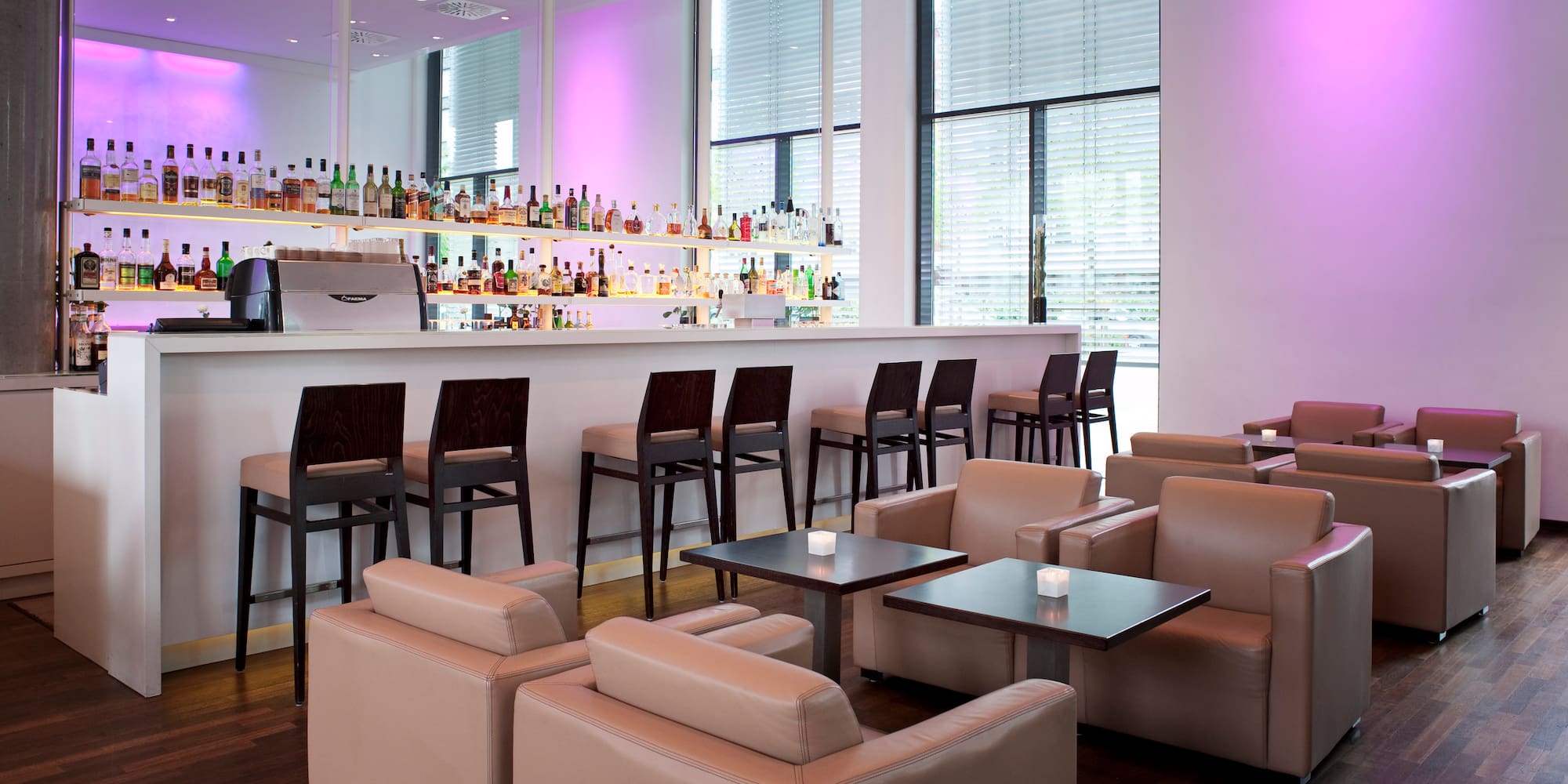 a bar with chairs and tables