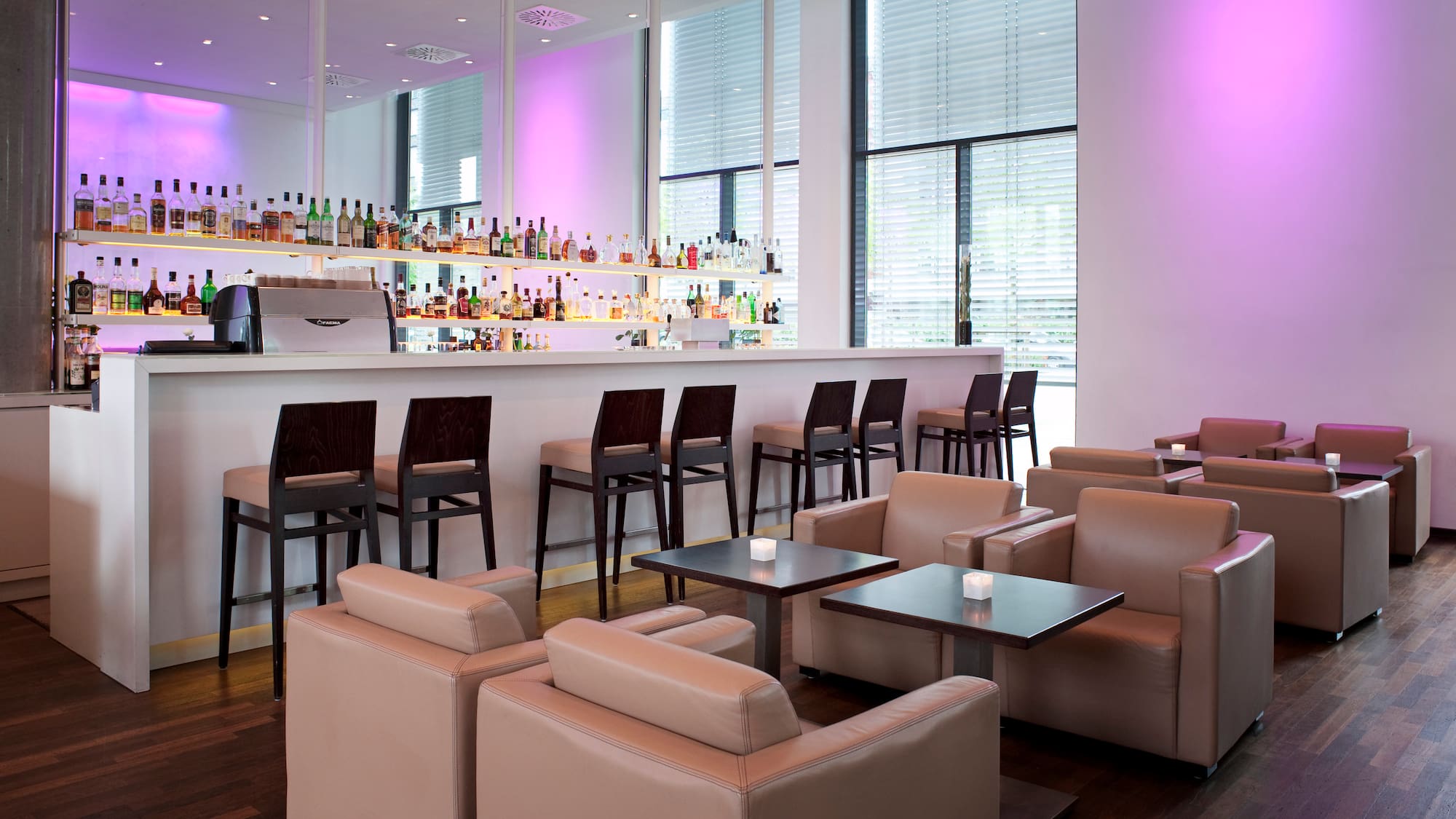 a bar with chairs and tables