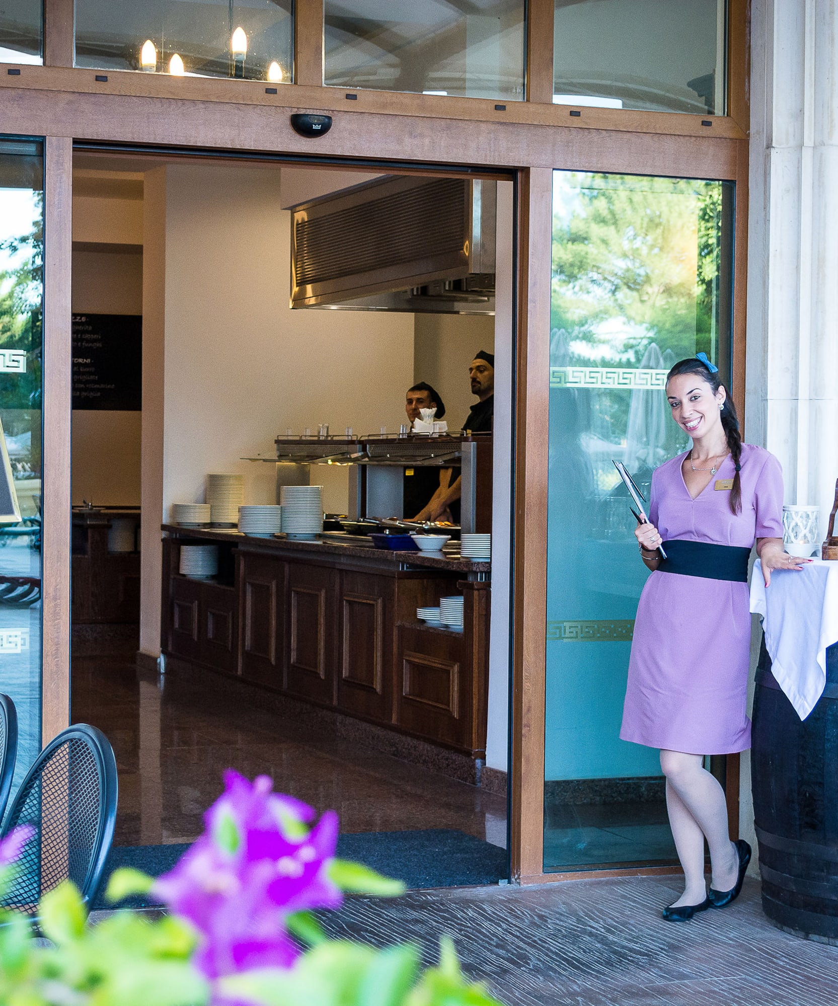 a woman standing outside a restaurant