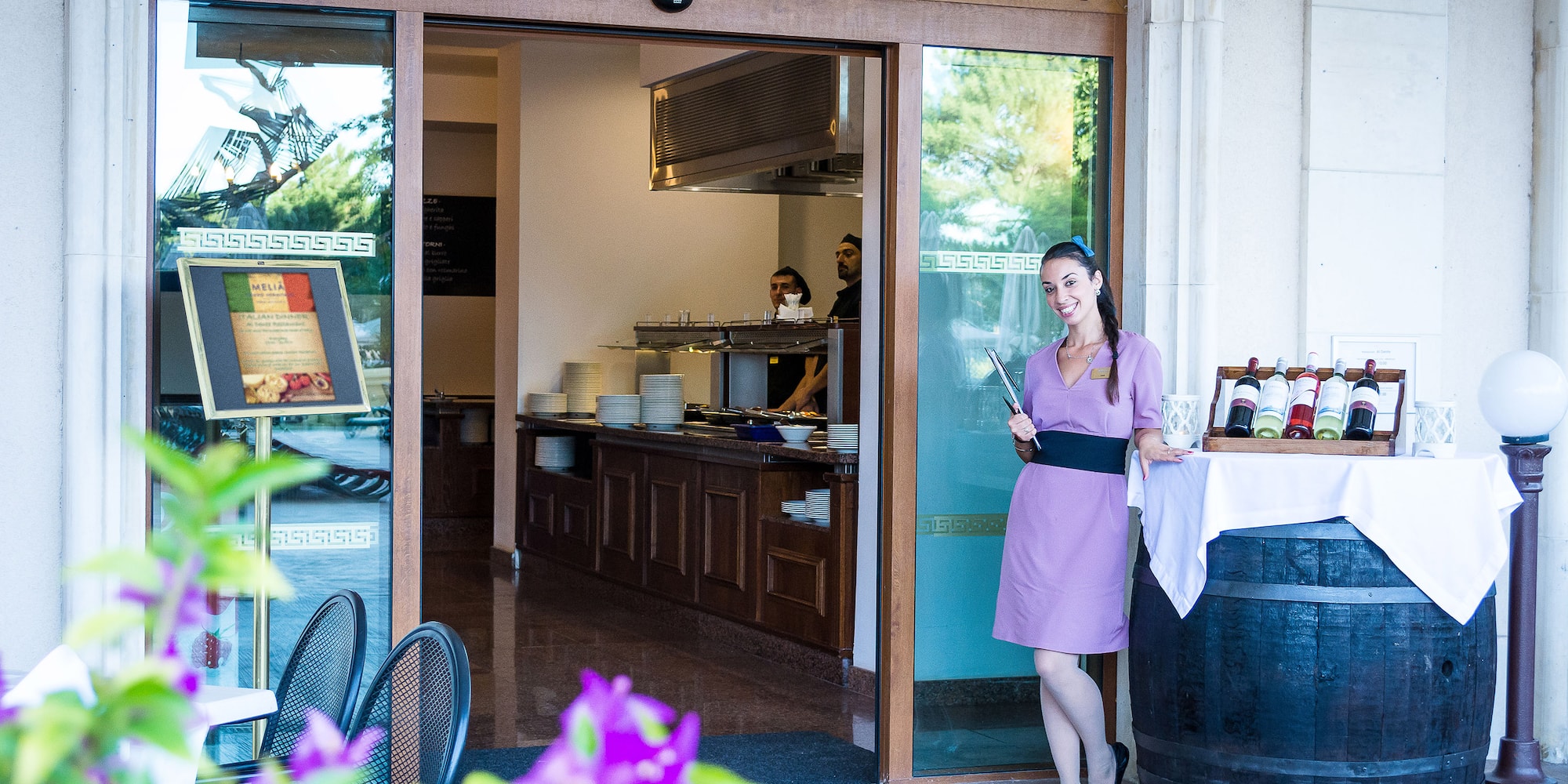 a woman standing outside a restaurant