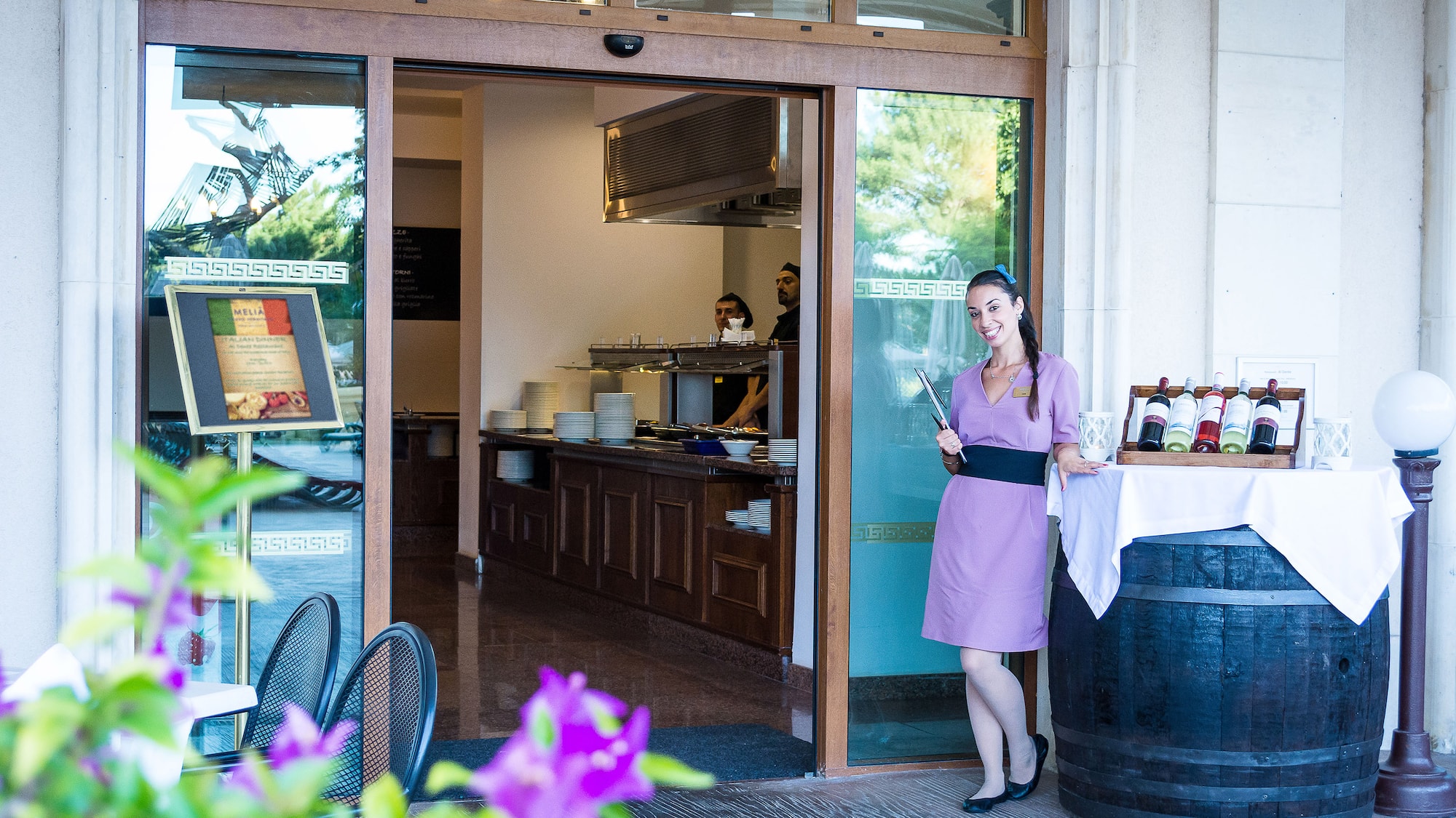 a woman standing outside a restaurant