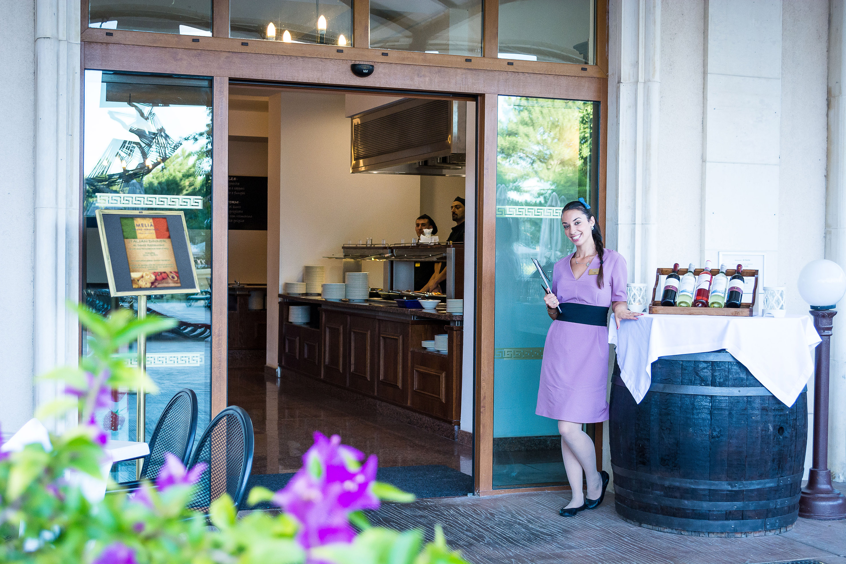 a woman standing outside a restaurant