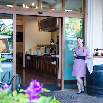 a woman standing outside a restaurant