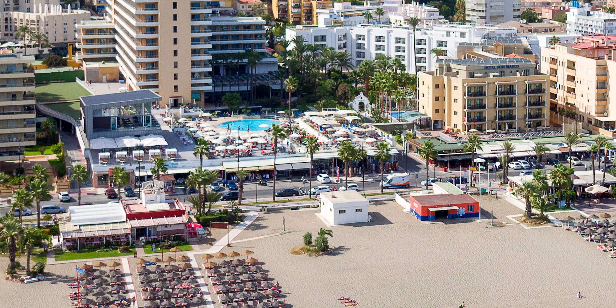 a beach with many buildings and a city