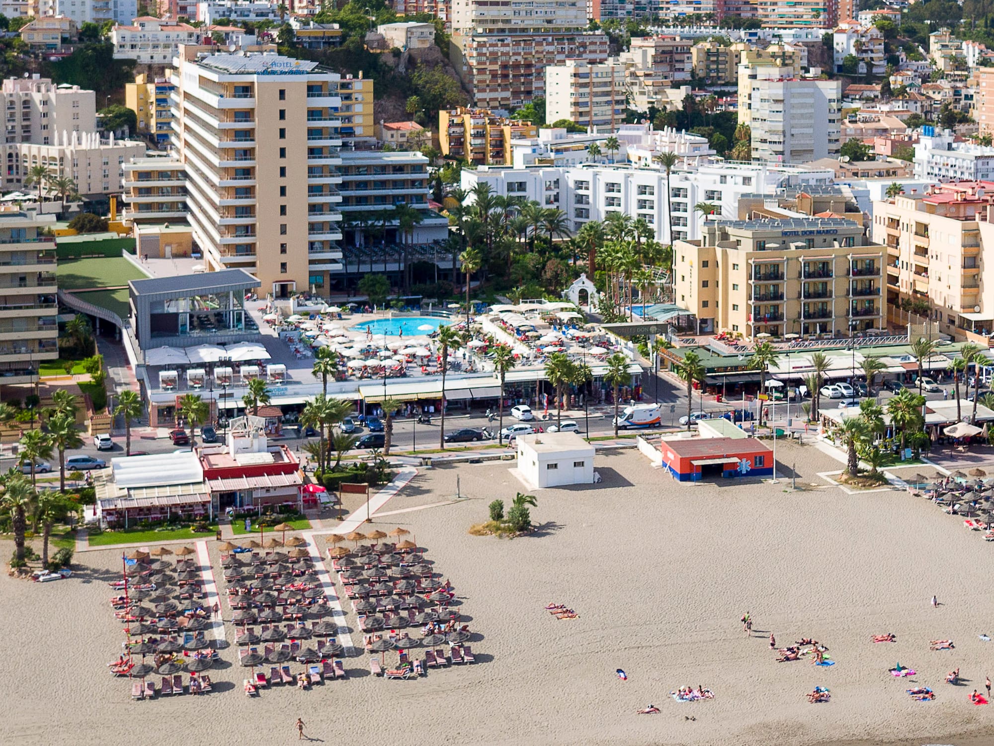a beach with many buildings and a city