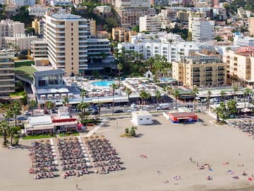 a beach with many buildings and a city