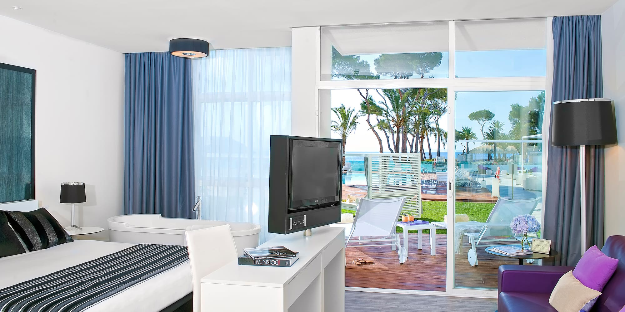 a room with a television and a bed