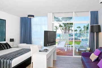 a room with a television and a bed