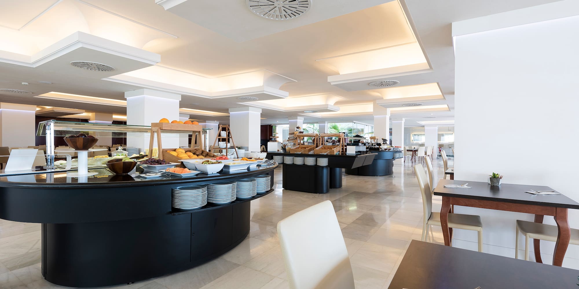 a restaurant with food on the counter