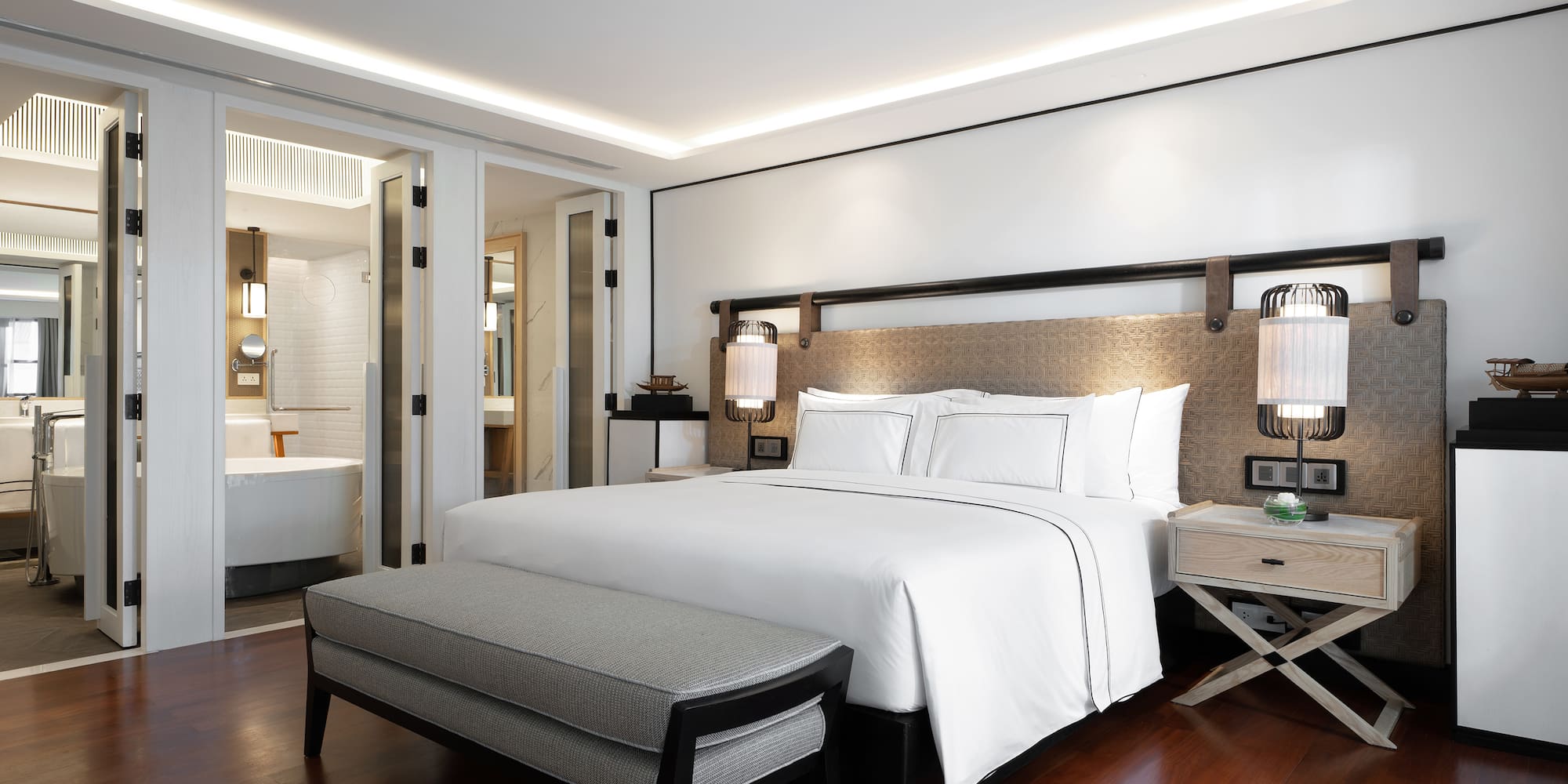 a bedroom with a bed and a bathtub