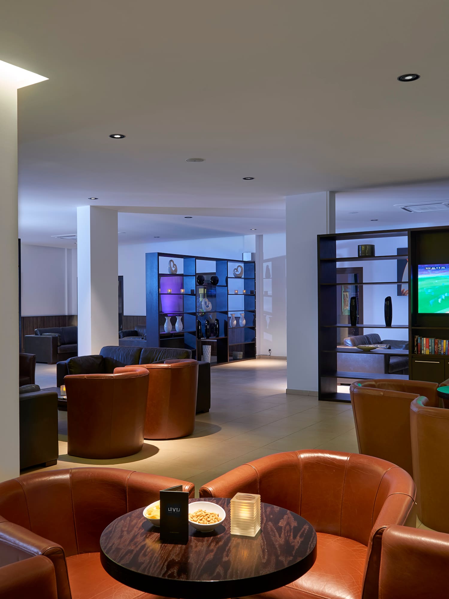 a room with a television and chairs