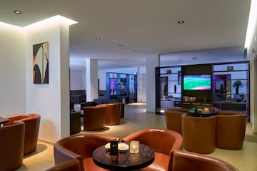 a room with a television and chairs