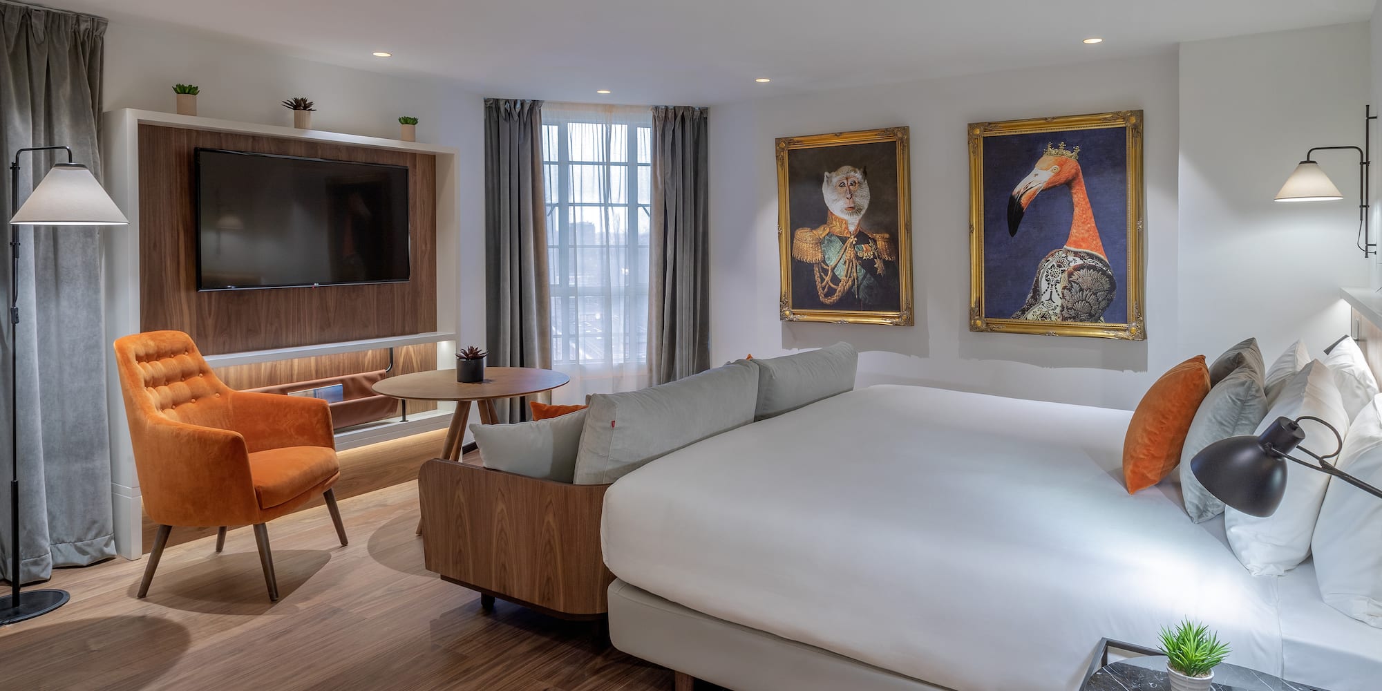 a room with a bed and a television