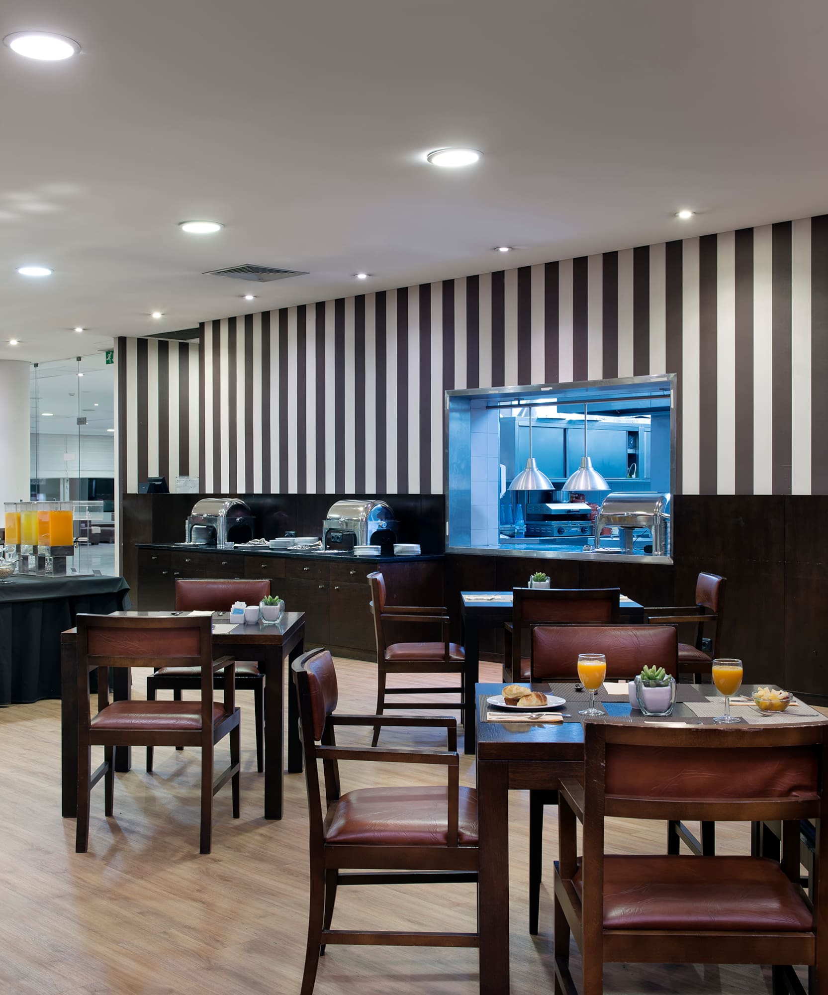 a restaurant with tables and chairs