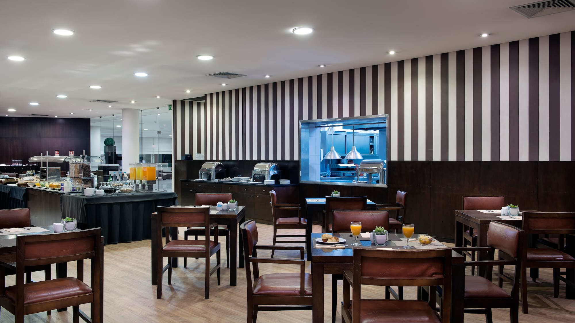 a restaurant with tables and chairs