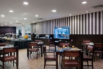 a restaurant with tables and chairs