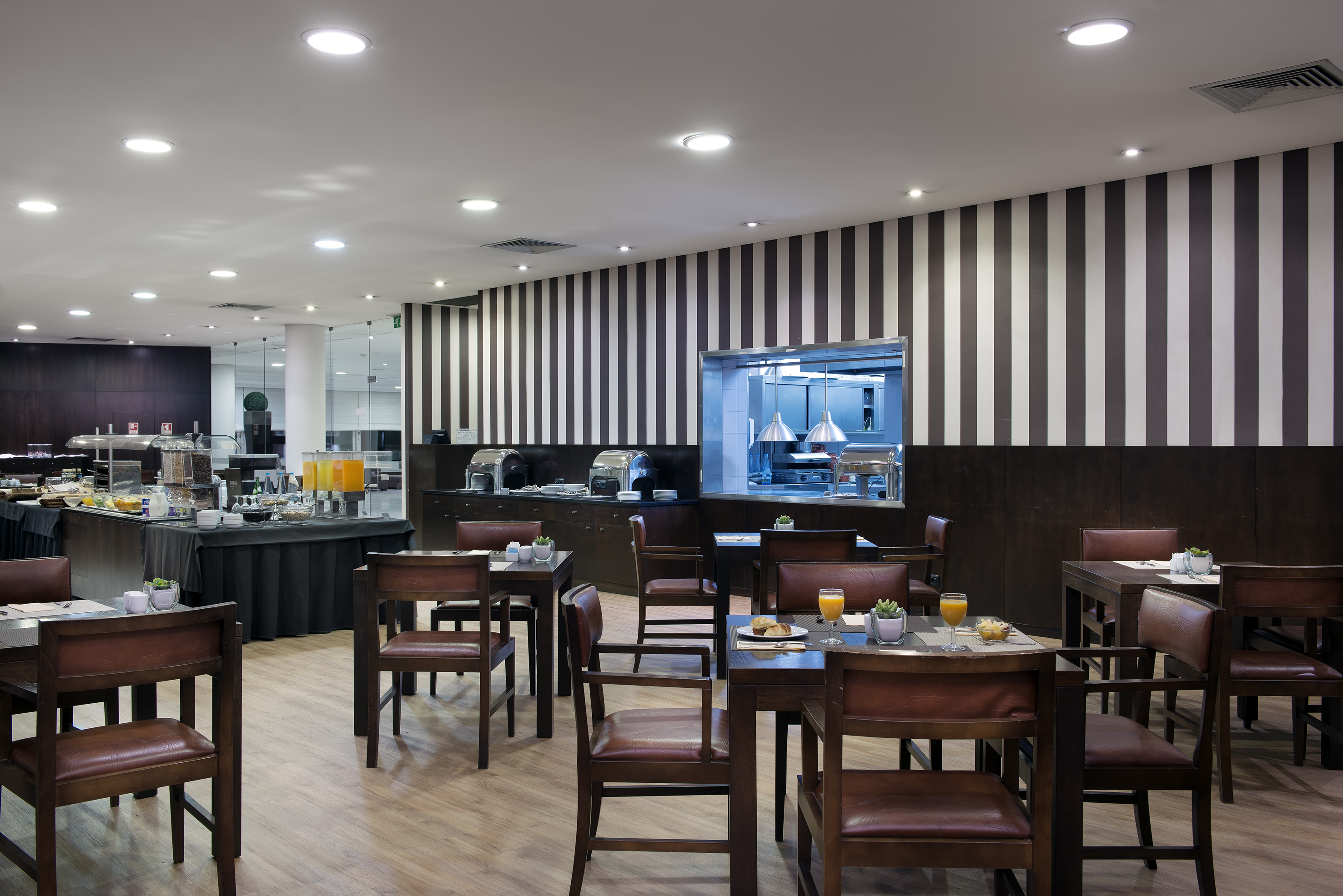 a restaurant with tables and chairs