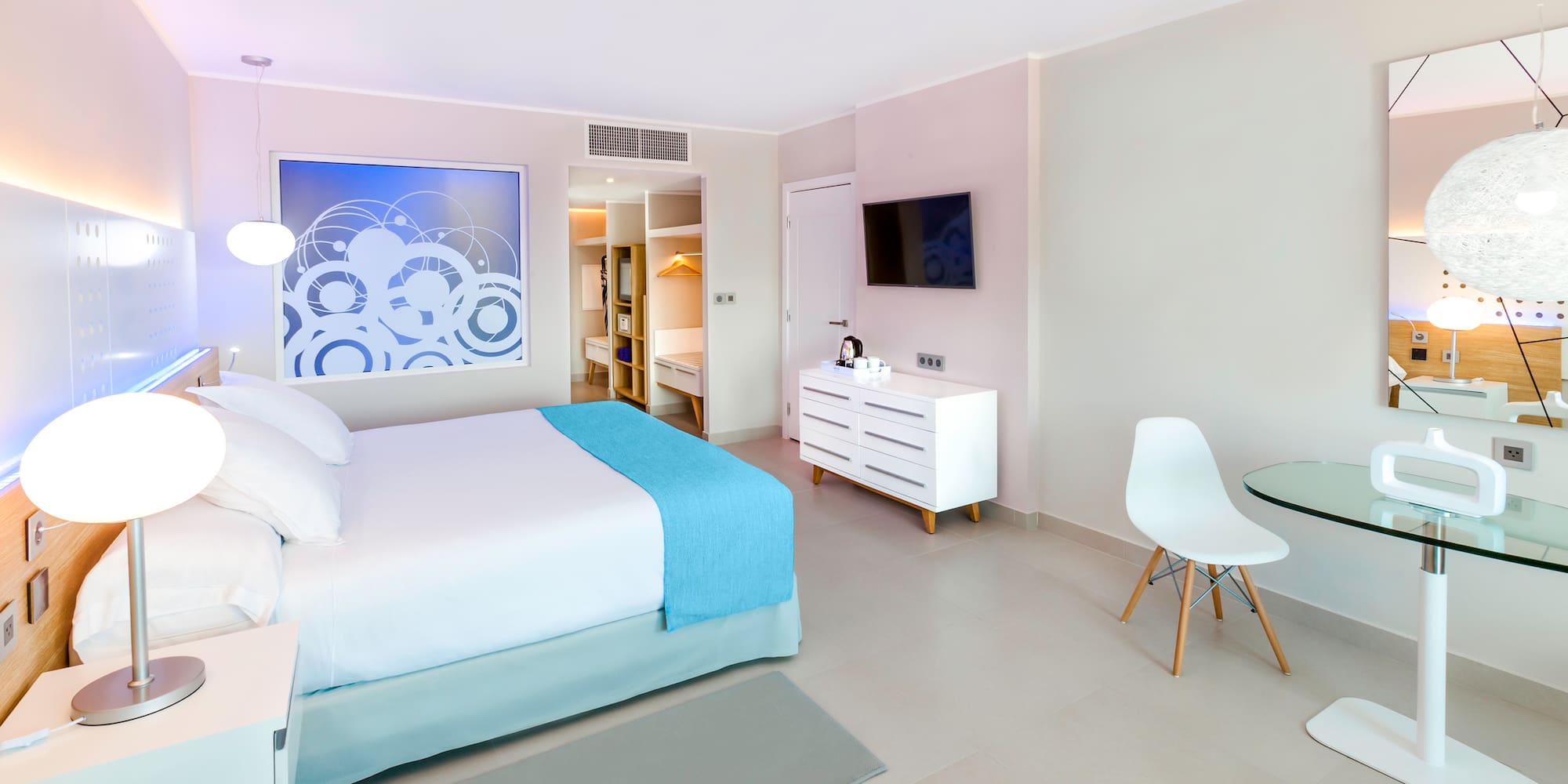 a bedroom with a bed and a table