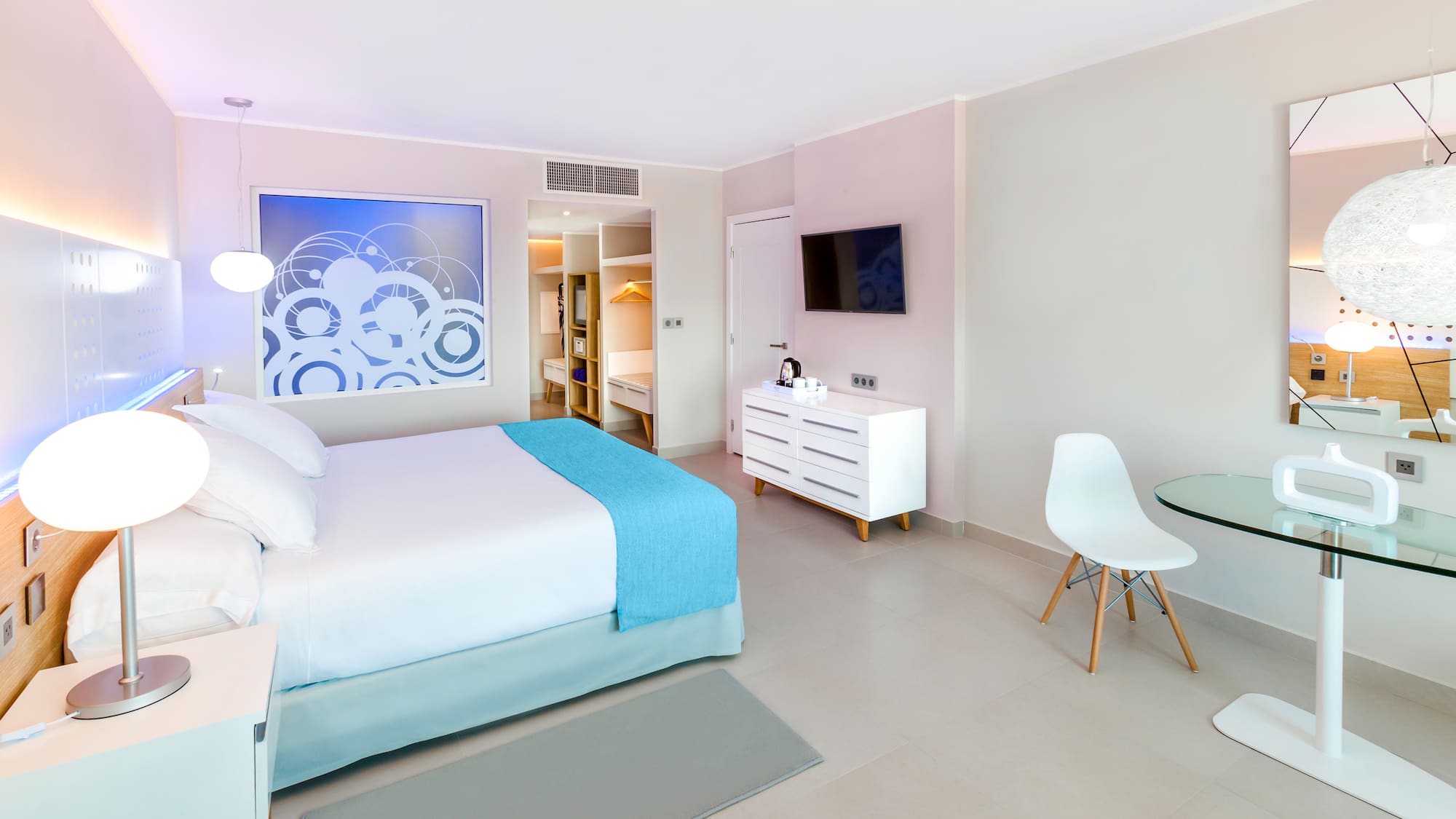 a bedroom with a bed and a table