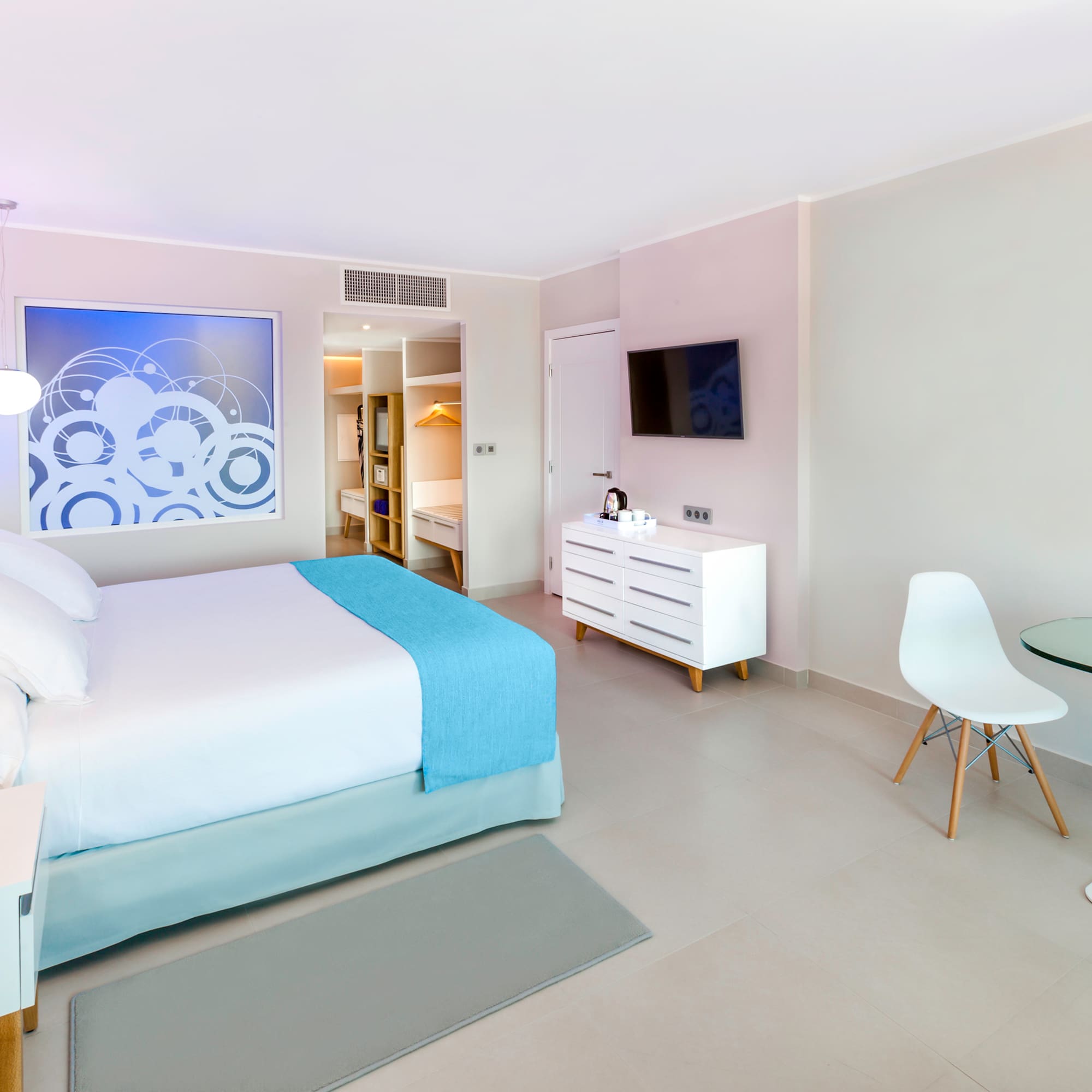 a bedroom with a bed and a table